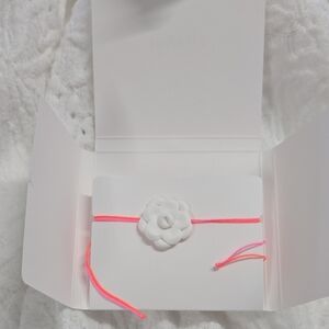 The bracelet is a part of Chanel's Camélia collection.